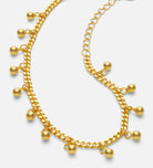 Dangling Dotted Bracelet in Gold