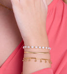 Dangling Dotted Bracelet in Gold